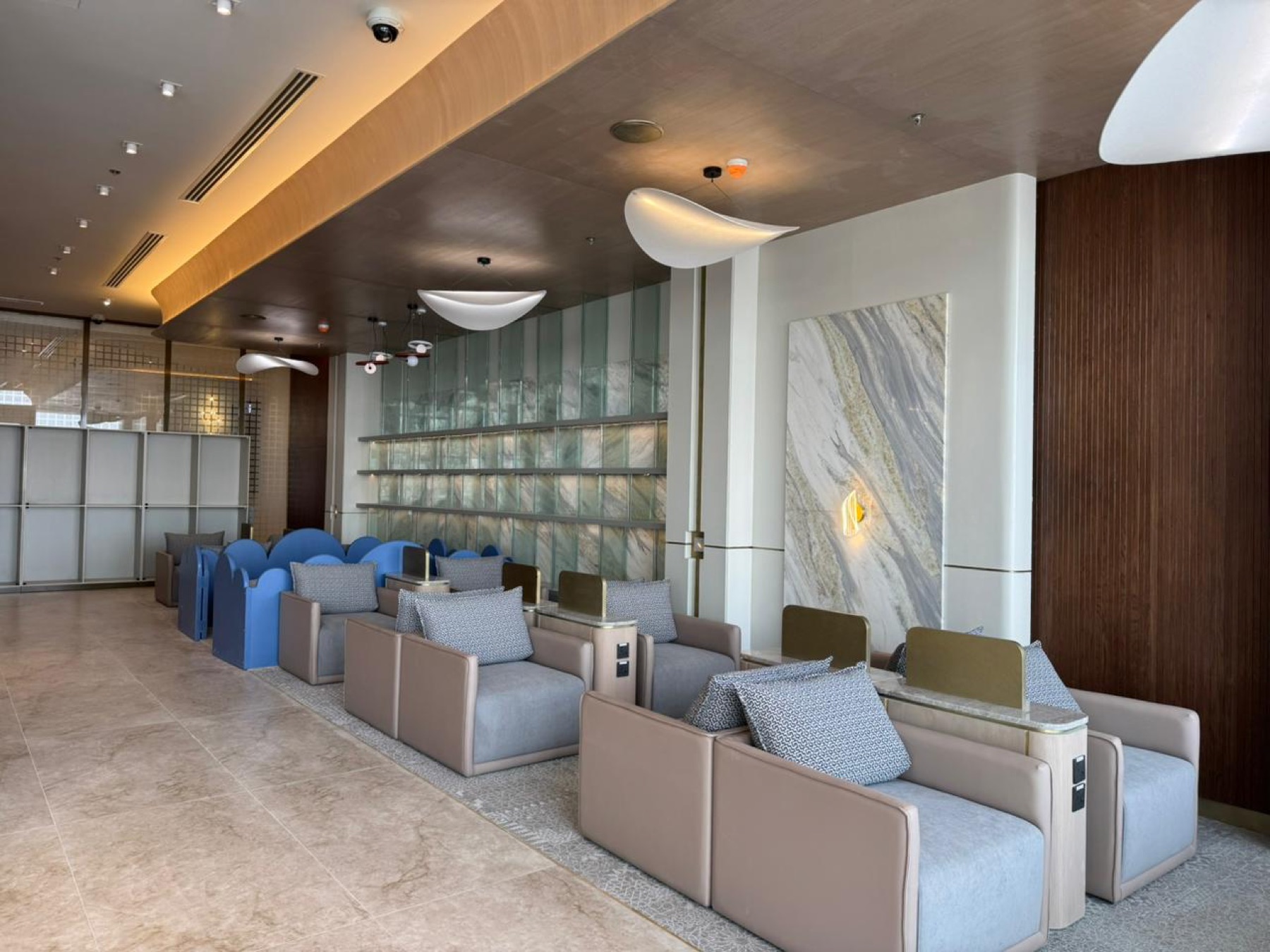 Safa Lounge seating hall with marble walls and traditional arched booths