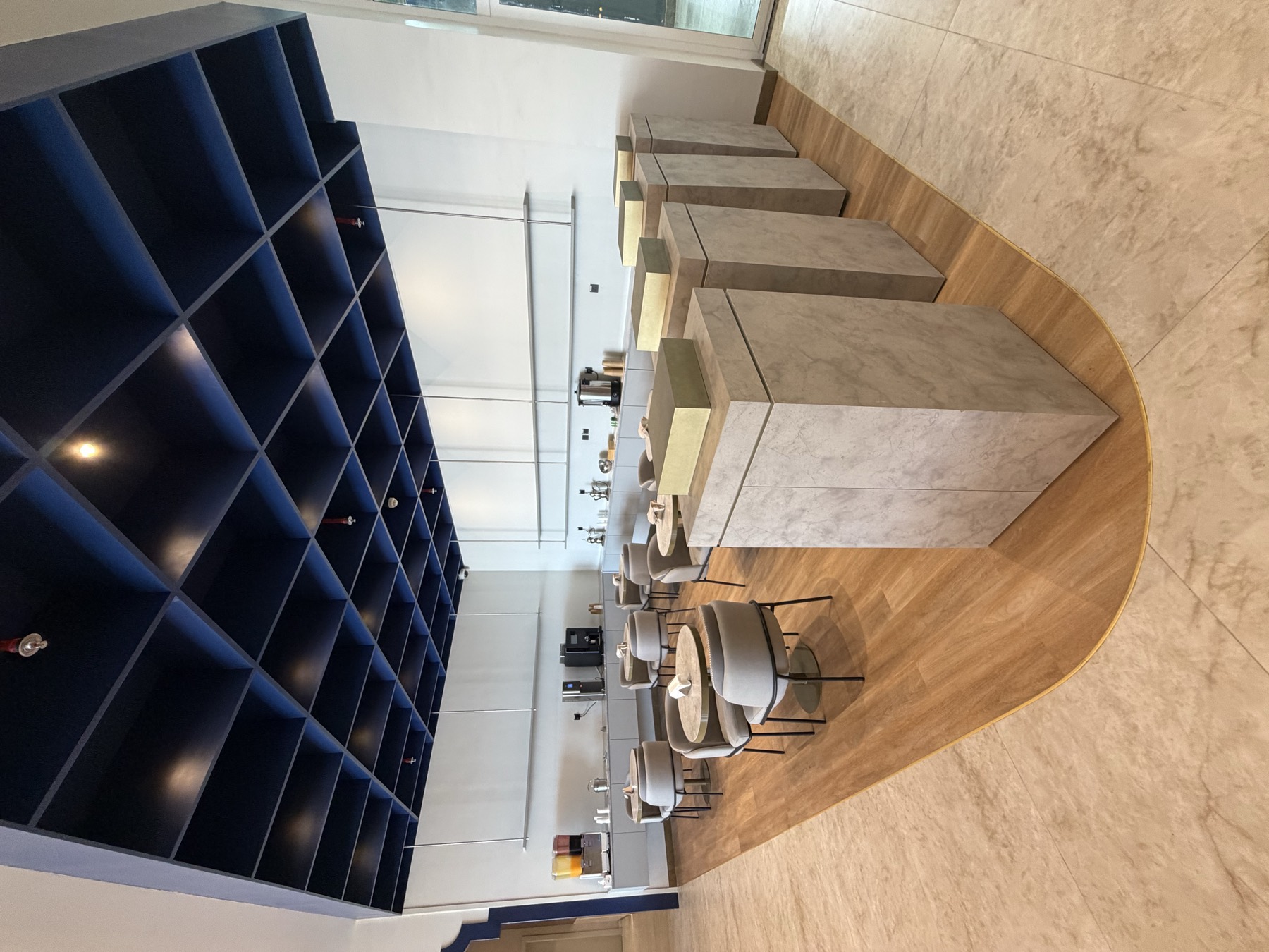 The café at Safa Lounge under a deep blue coffered ceiling