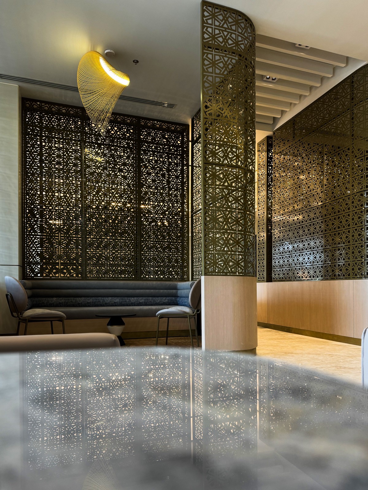 Hand-crafted brass mashrabiya screens inside Safa Lounge